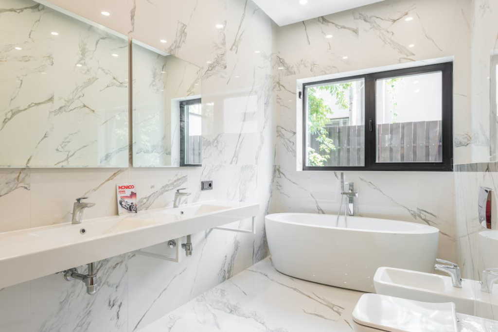 A White Bathtub and Sink in the Bathroom Remodel